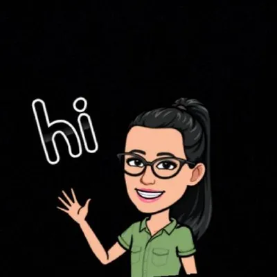 Image of the author smiling and eating desserts